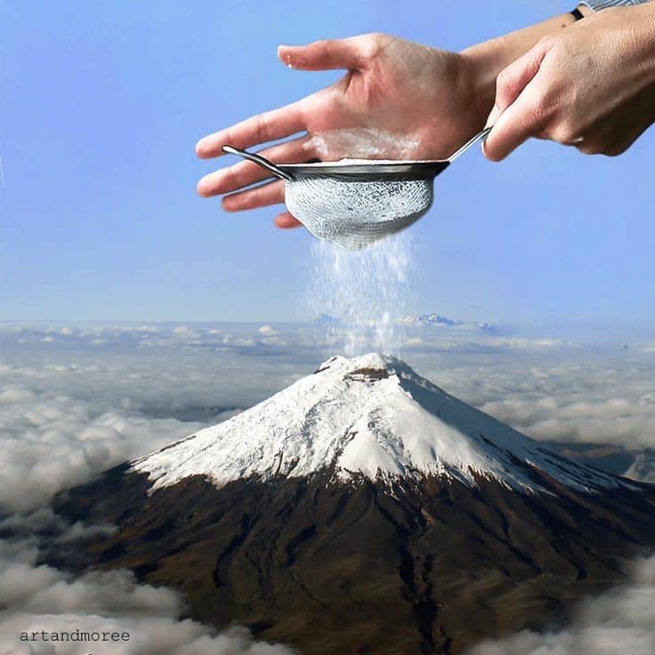 Surreal art: hands sifting snow onto snowy mountain peak, blending nature and creativity.