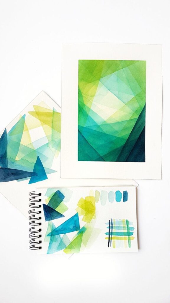 Abstract watercolor artwork with green and blue geometric shapes on paper. Vibrant art composition.