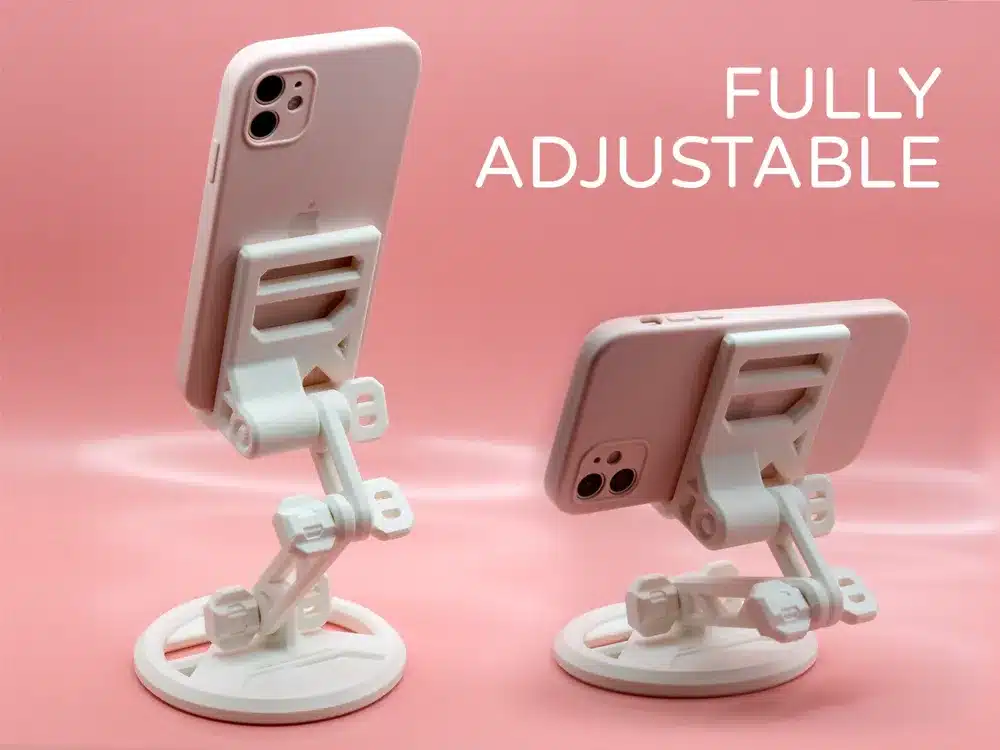 Fully adjustable white smartphone stands with phones on a pink background.