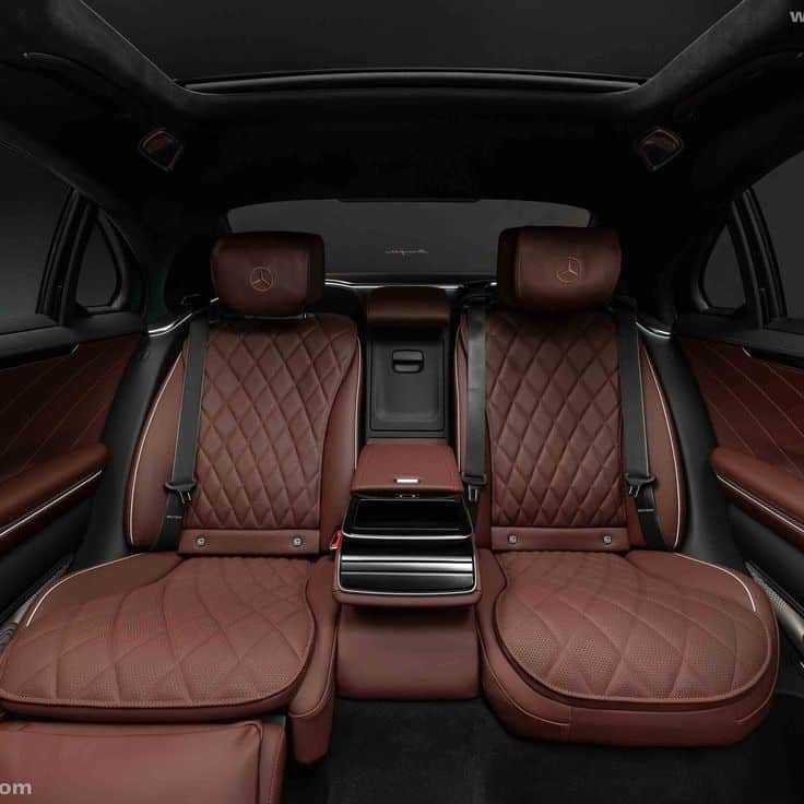Luxurious car interior with brown leather seats and sleek design, showcasing elegance and comfort in automotive style.
