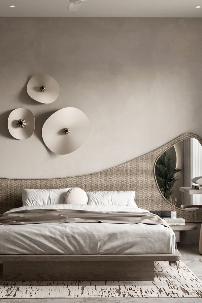 Modern bedroom with neutral tones, abstract wall decor, minimalistic furniture, and a textured headboard.