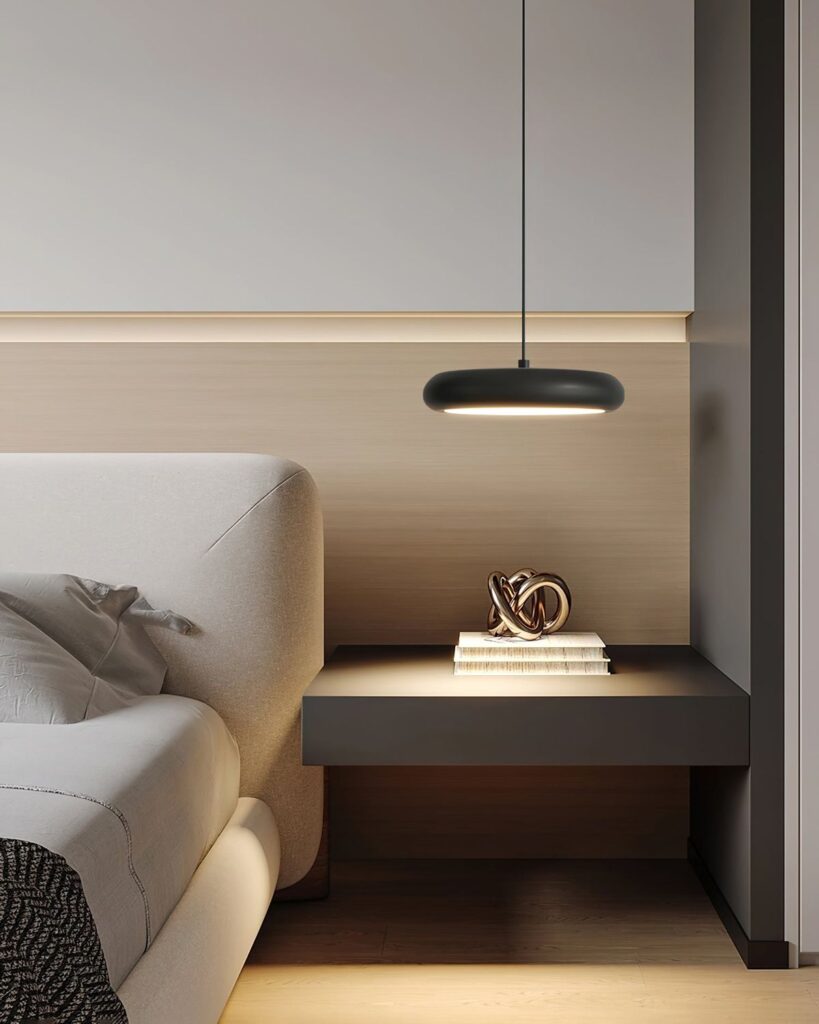 Modern bedroom with minimalist design featuring a sleek black pendant light and a floating bedside table with decor.