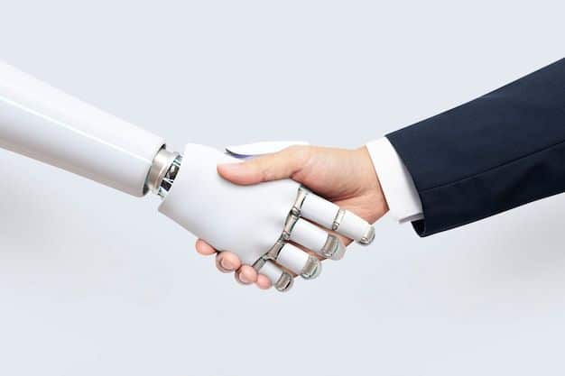 Human hand shaking with robotic hand, symbolizing strong human-technology collaboration and innovation.