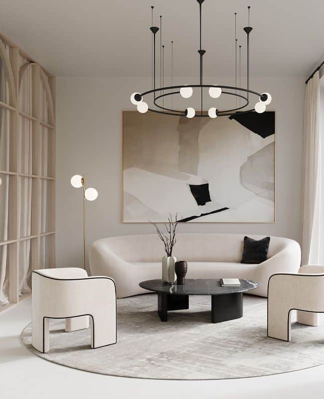 Modern living room with abstract art, elegant chandelier, curved sofa, armchairs, and round coffee table. Minimalist design.