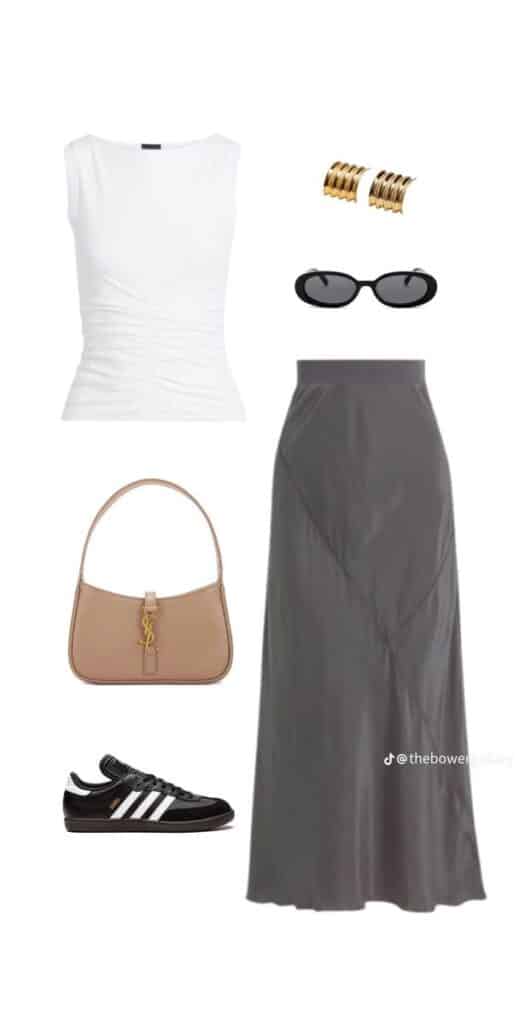 Chic outfit with white sleeveless top, gray skirt, gold earrings, sunglasses, tan handbag, and black sneakers.