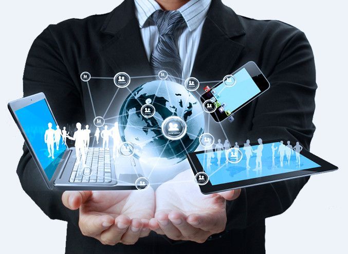 Businessman holding digital globe with devices, symbolizing global connectivity and modern technology.