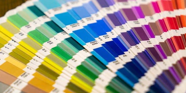 Color swatches arranged in gradient, featuring a spectrum from yellow to blue, showcasing various paint shades.