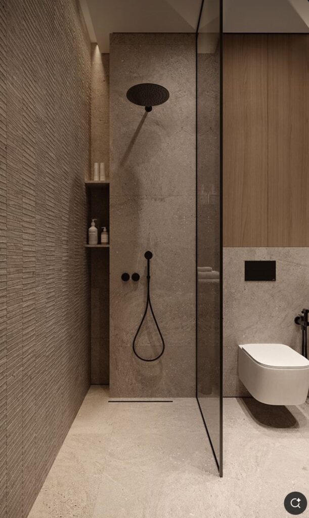 Modern minimalist bathroom with beige tiles, rainfall shower, glass partition, and wall-mounted toilet.