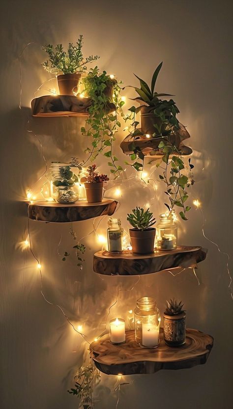 Floating shelves with potted plants and candles lit by string lights create a cozy, ambient decor setup.