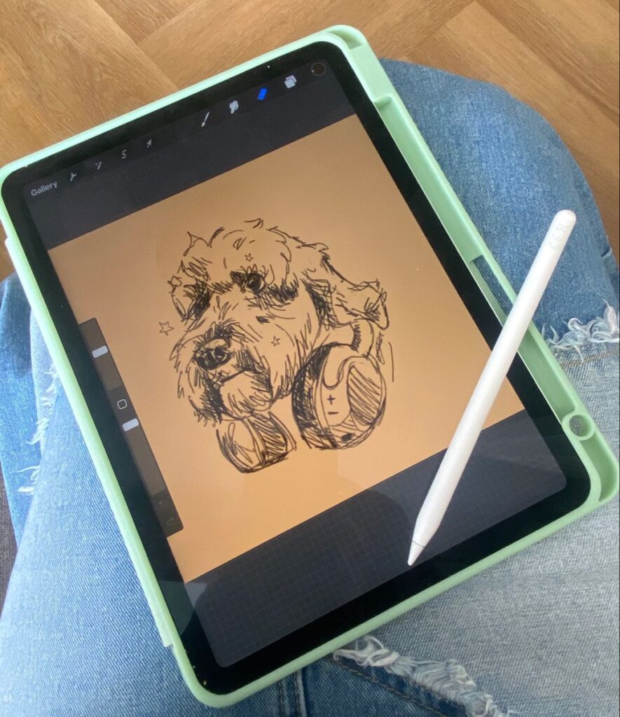 Digital artwork of a dog with headphones on a tablet screen, placed on a person's lap with denim jeans.