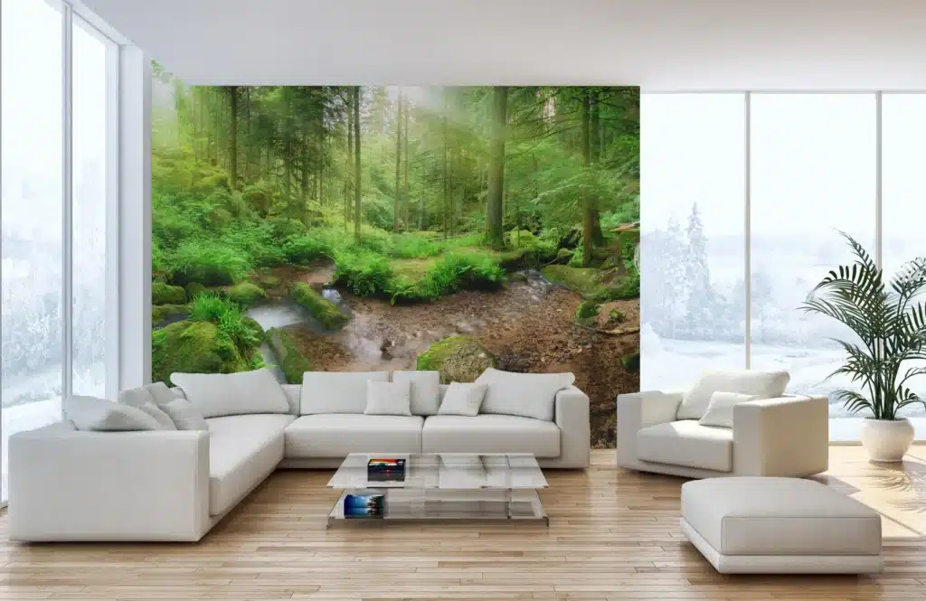 B167Enchantingpanoramicforestscenerywithsoftlightfallingthroughthefoliage_5 Modern living room with a nature-themed wall mural, white furniture, and large windows. | Sky Rye Design Modern living room with a nature-themed wall mural, white furniture, and large windows.