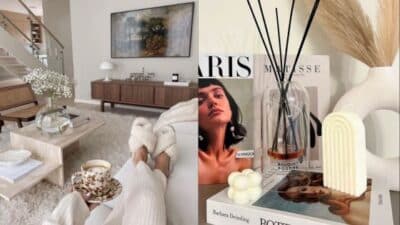 Cozy living room with modern decor, books, scented candles, and a stylish coffee table. Perfect for relaxation.