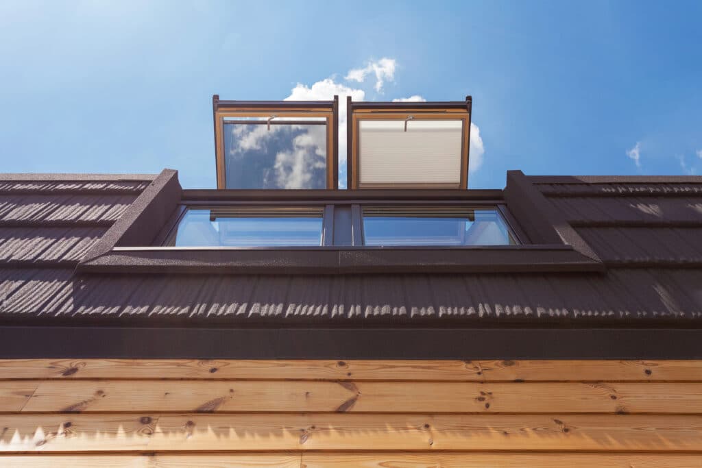 Depositphotos_119153896_XL Open wooden attic windows under clear blue sky, viewed from below. | Sky Rye Design Open wooden attic windows under clear blue sky, viewed from below.