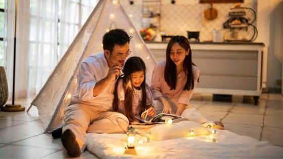 Emergency Electrical Repairs Shouldnt Ignore Family reading together inside a cozy tent with warm string lights in a modern kitchen setting. | Sky Rye Design Family reading together inside a cozy tent with warm string lights in a modern kitchen setting.