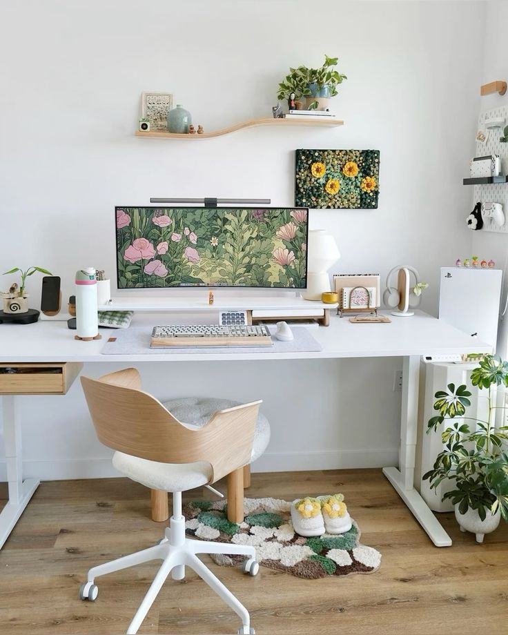 Stylish home office with a wooden desk, ergonomic chair, plants, and nature-themed monitor wallpaper. Cozy and organized.