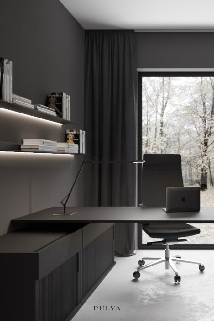 Modern black home office with a sleek desk, bookshelves, and a large window view.