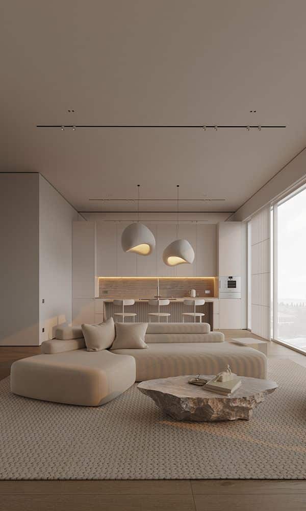 Modern minimalist living room with beige sofa, stone coffee table, and stylish lighting.