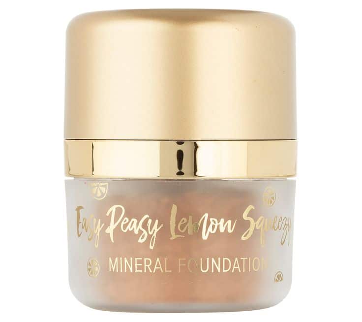 Gold-capped Easy Peasy Lemon Squeezy mineral foundation in clear jar, highlighting natural beauty and smooth finish.