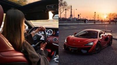 Person driving luxury car at sunset with cityscape; red sports car parked, Eiffel Tower in background.