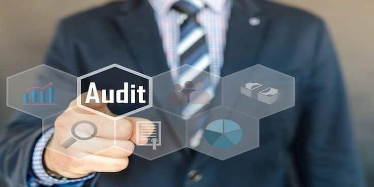 Maximize your resources with our audit services Businessman pointing at digital audit icon with financial and data analysis symbols in the background. | Sky Rye Design Businessman pointing at digital audit icon with financial and data analysis symbols in the background.