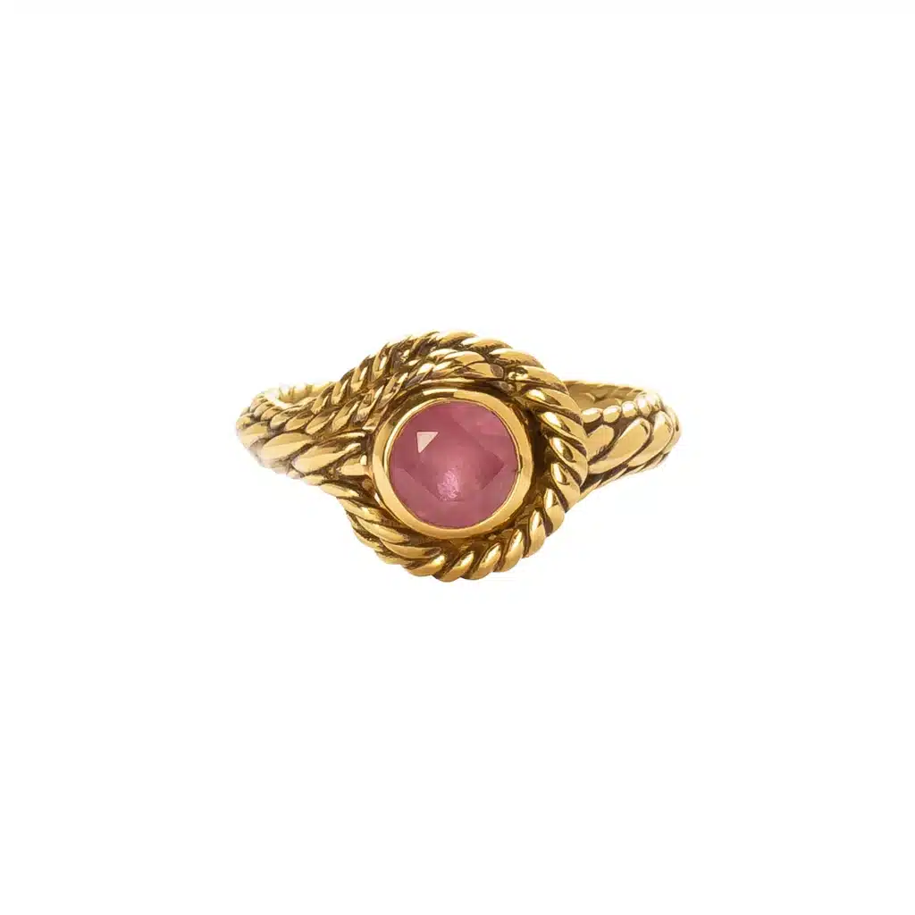 Elegant gold ring with twisted band featuring a vibrant pink gemstone in the center. Perfect for a touch of luxury.
