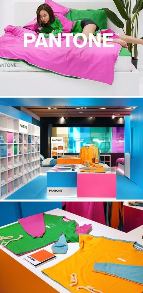 Pantone-inspired colorful room with vibrant bedding, T-shirts, and accessories. Bright, modern interior design.