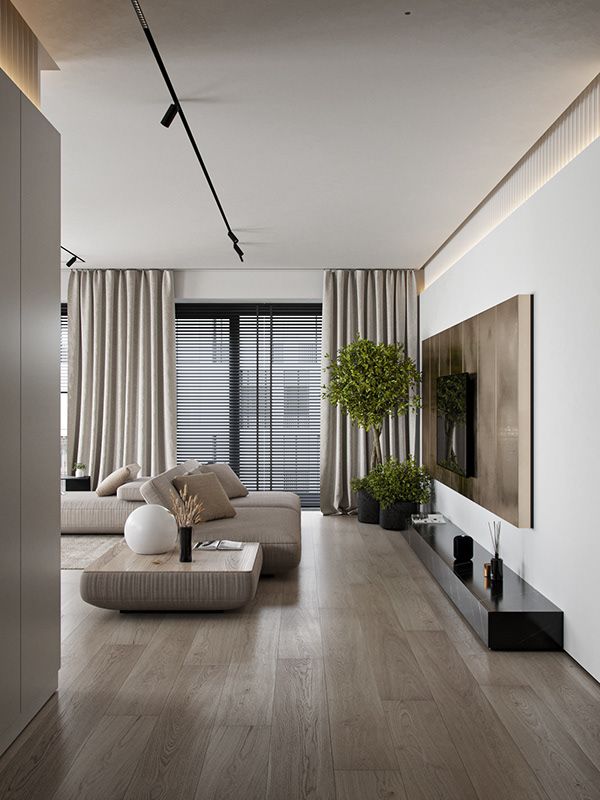 Modern living room with beige sofa, large TV, potted plants, and sleek decor. Natural light from floor-to-ceiling windows.