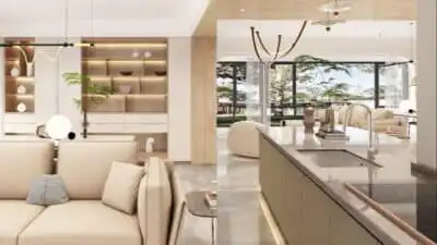 Modern open-concept living room and kitchen with neutral colors, large windows, and stylish decor.