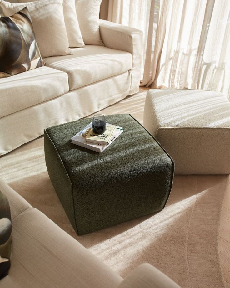 The Hollis Ottoman 🖤✨ The perfect addition to your living space_ Now 30 off - get in quick Limited time Modern living room with light sofa, green ottoman, and sunlight through curtains, creating a cozy reading nook. | Sky Rye Design Modern living room with light sofa, green ottoman, and sunlight through curtains, creating a cozy reading nook.