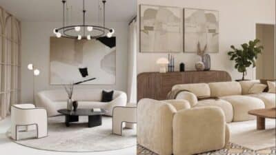 Modern living room with beige sofas, abstract art, and minimalist decor.