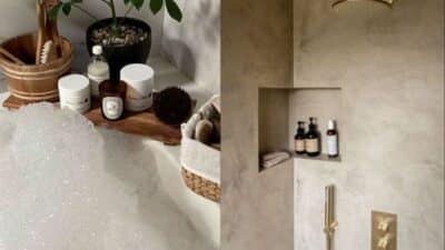 Luxurious spa-like bathroom with bubble bath, skincare products, plants, and elegant shower essentials for relaxation.