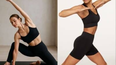 Women in black workout attire performing yoga poses, showcasing strength and flexibility in a serene environment.