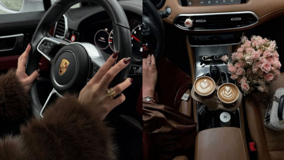 Luxurious car interior with coffee cups and flowers, showcasing stylish driving and elegance.