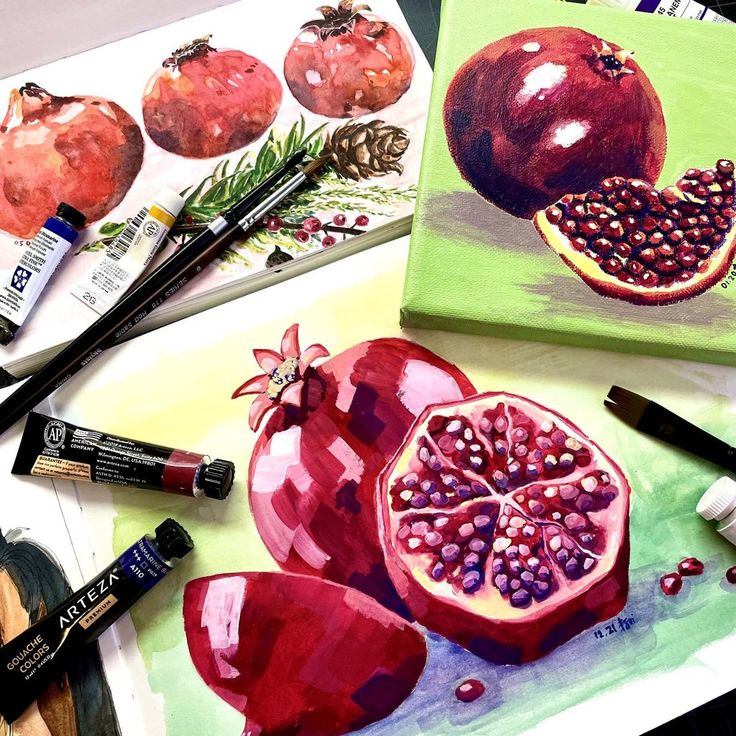 Paintings of pomegranates with art supplies, showcasing vibrant colors and detailed brushwork.