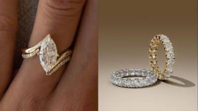 Close-up of marquise diamond engagement ring and eternity bands in gold and silver settings.