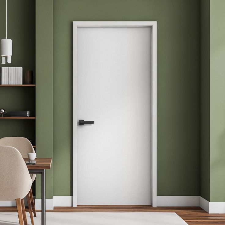 White Internal Primed Smooth Lifestyle Flush Door 116470 Modern interior with white door, green walls, and wood accents. Elegant and minimalist home office design. | Sky Rye Design Modern interior with white door, green walls, and wood accents. Elegant and minimalist home office design.