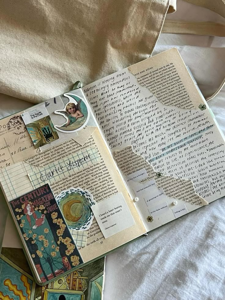 Open scrapbook with handwritten notes, vintage magazine cutouts, and decorative stickers on a beige fabric background.