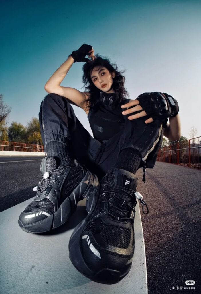 Street style fashion with black sneakers and casual outfit. Urban vibe, daytime, angled perspective.