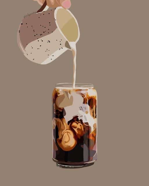 Pouring creamy milk into iced coffee in a glass, creating a swirling effect on a neutral background.