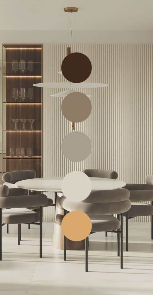 Modern dining room with elegant pendant light, round table, and plush gray chairs against a ribbed wall background.