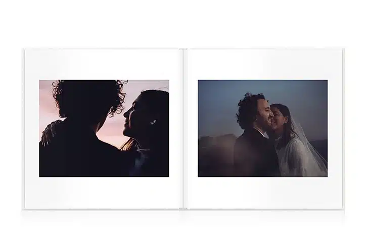 Open photo album with romantic couple portraits at sunset and night, showcasing intimate moments.