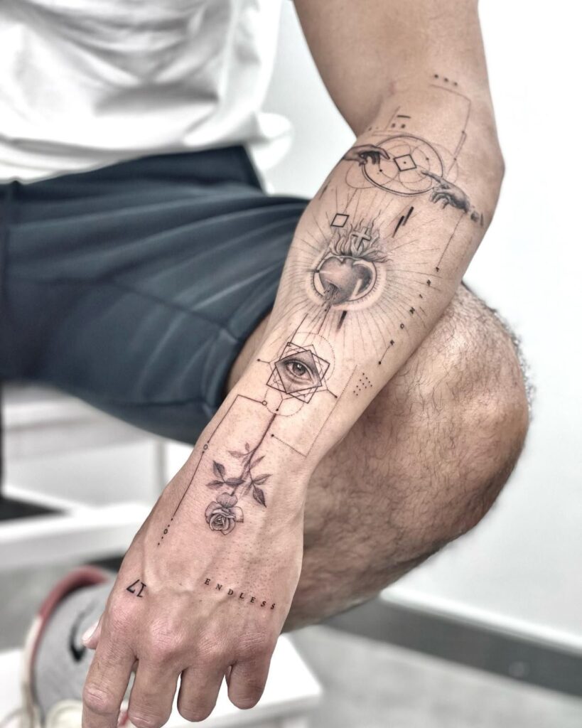 Forearm tattoo with geometric designs, eye, heart, rose, and the word endless in black and white style.