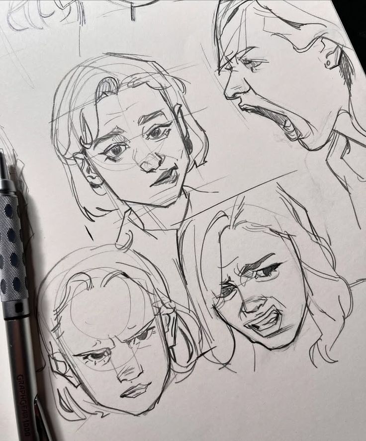 Pencil sketches of expressive faces, each conveying different emotions, drawn on paper with visible pen.