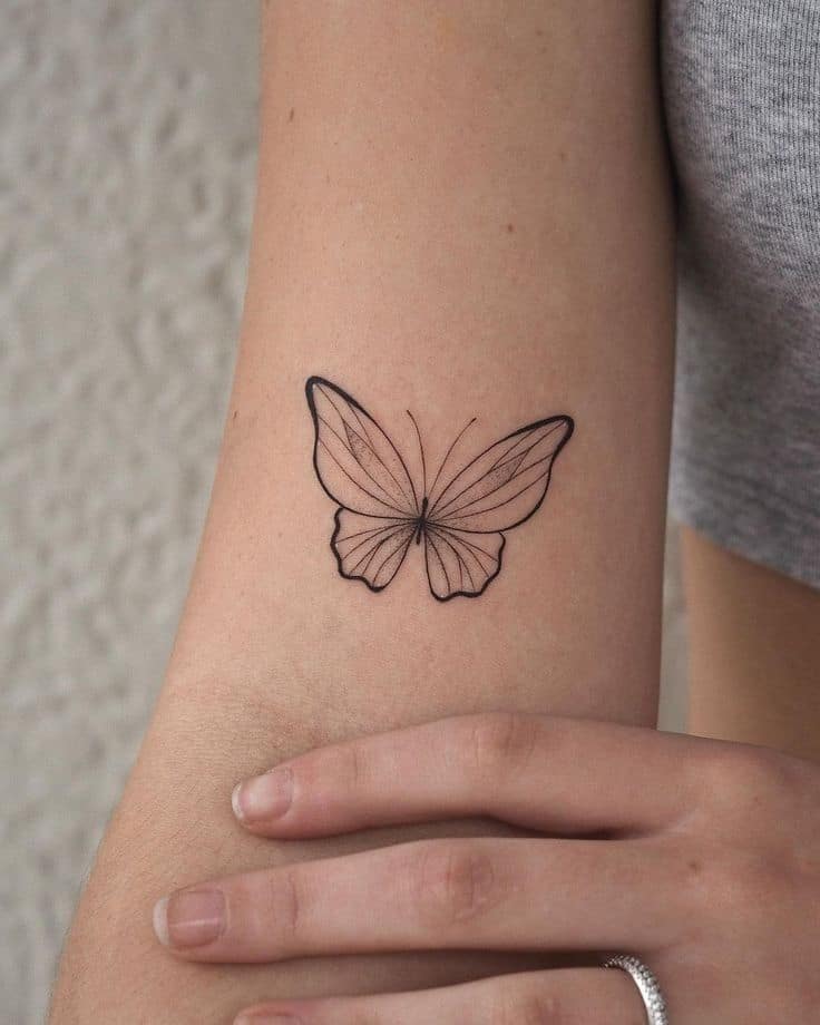 _ Elegant butterfly tattoo on forearm with delicate linework detail. | Sky Rye Design Elegant butterfly tattoo on forearm with delicate linework detail.