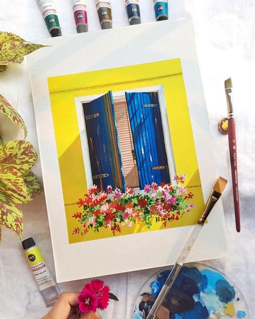Painting of a vibrant window with blue shutters and colorful flowers, surrounded by painting tools and leaves.