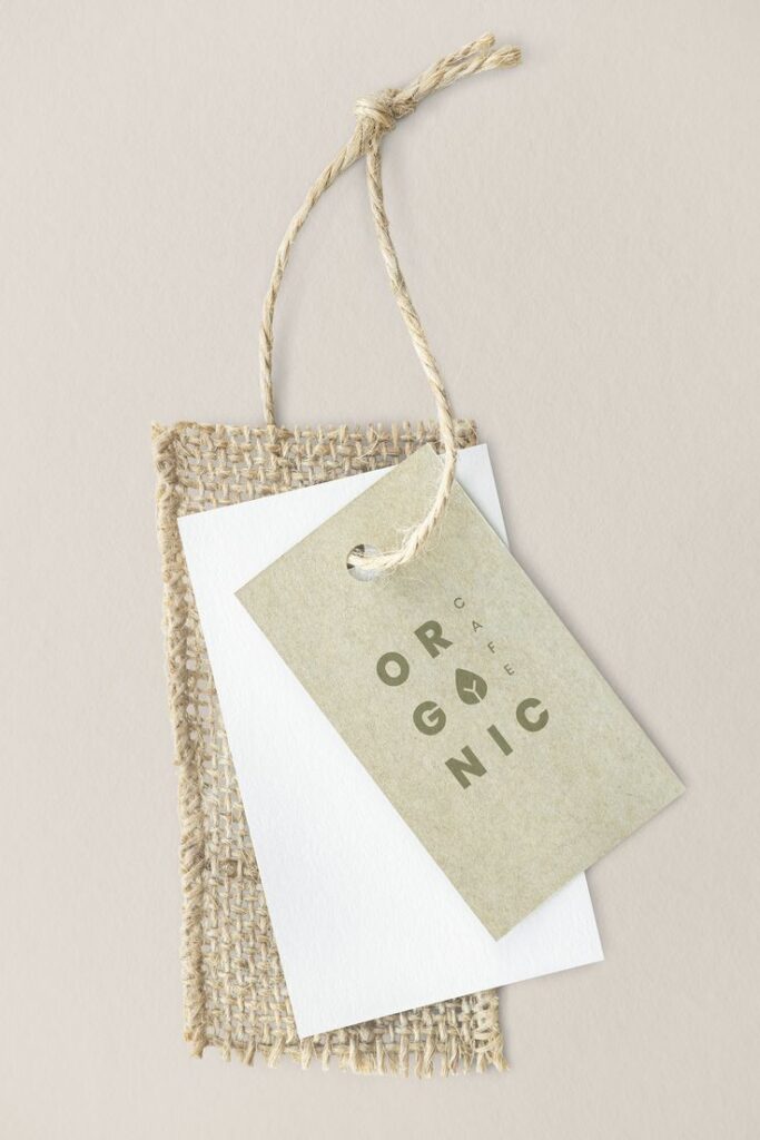 Organic cafe design label mockup Eco-friendly packaging with organic tag on burlap and paper, highlighting sustainable design and earthy tones. | Sky Rye Design Eco-friendly packaging with organic tag on burlap and paper, highlighting sustainable design and earthy tones.