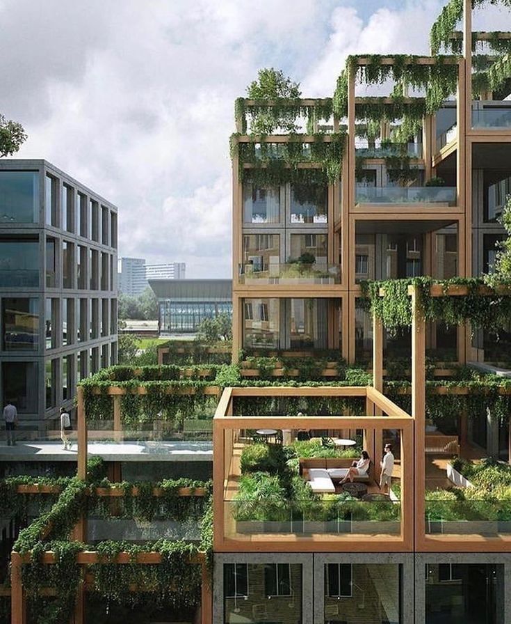 Modern architectural building with greenery-covered terraces and patios, featuring urban living spaces and lush landscapes.