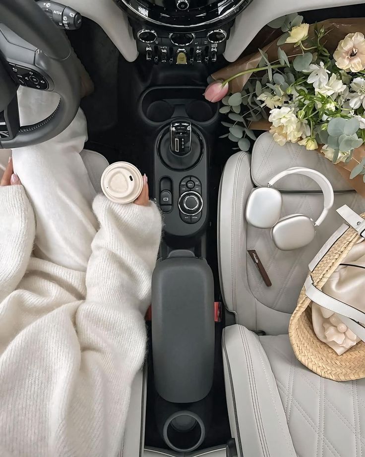 100+ Editable Templates _ KDP 2026 Graphic by Interior Creative Creative Fabrica Cozy car interior with coffee, bouquet of flowers, headphones, and a bag on white seats, offering a serene drive vibe. | Sky Rye Design Cozy car interior with coffee, bouquet of flowers, headphones, and a bag on white seats, offering a serene drive vibe.