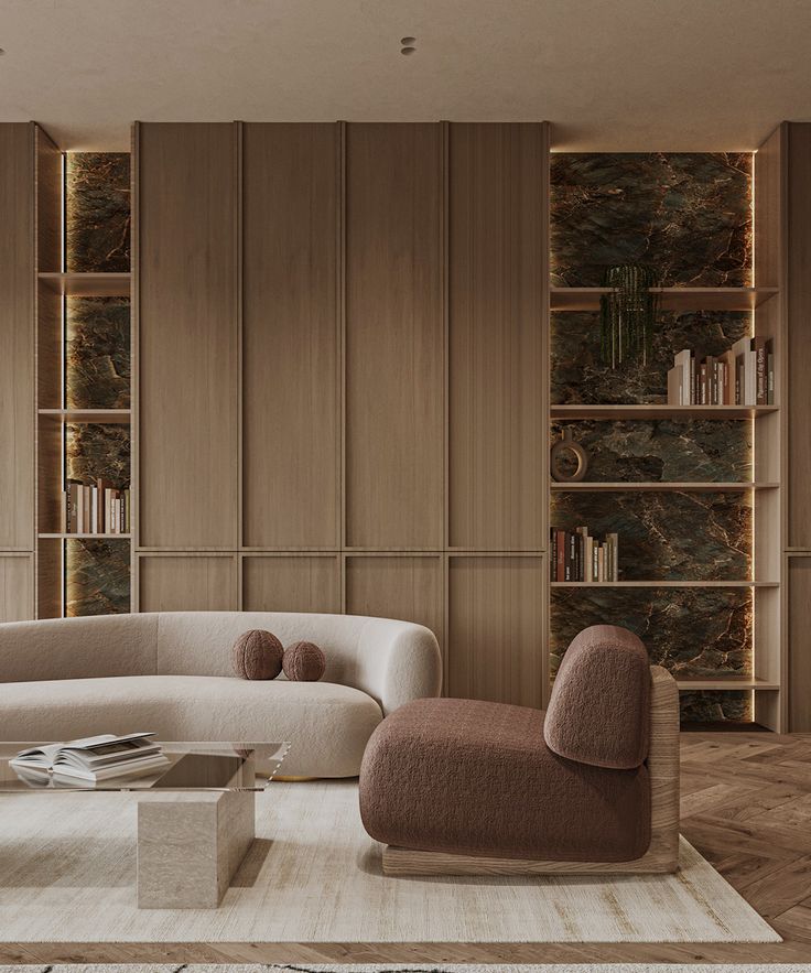 Modern living room with cozy beige and brown seating, marble accents, wood paneling, built-in shelves, and soft lighting.