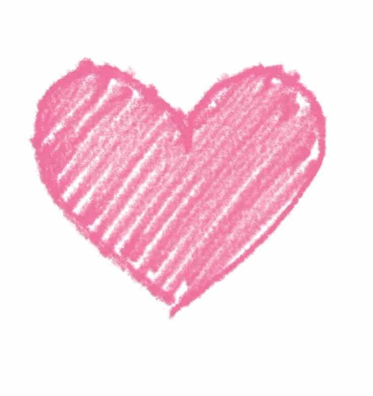 Crayon-drawn pink heart symbolizing love and affection on a plain white background.